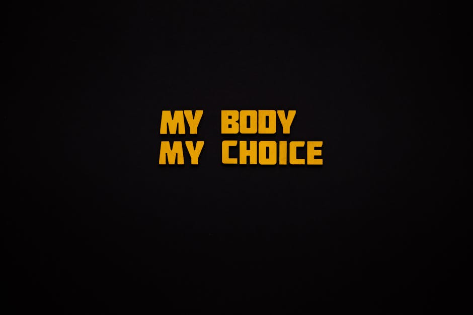 Bold 'My Body My Choice' phrase on a minimalist black background.