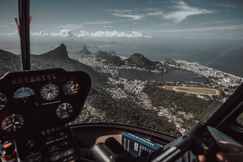 Stunning aerial view of Rio de Janeiro from a helicopter with skyline and horizon.