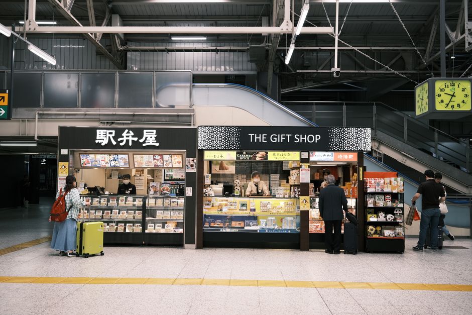 Captivating view of shops in Tokyo station, bustling with people and vibrant displays.
