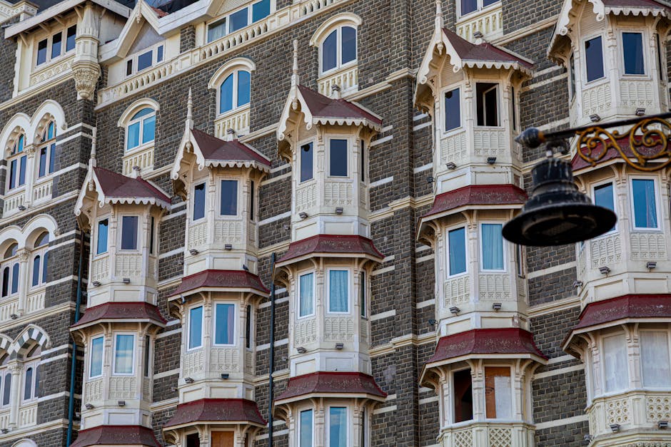 Detailed view of the historic Taj Mahal Palace facade in Mumbai, showcasing its Victorian architecture.