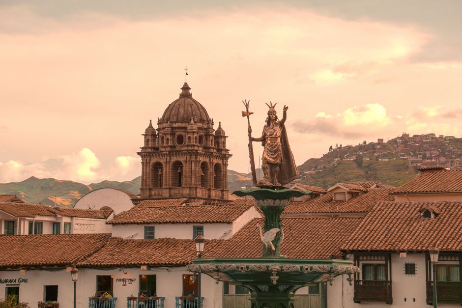 Capture of Plaza de Armas in Cusco, showcasing colonial architecture and mountain backdrop.