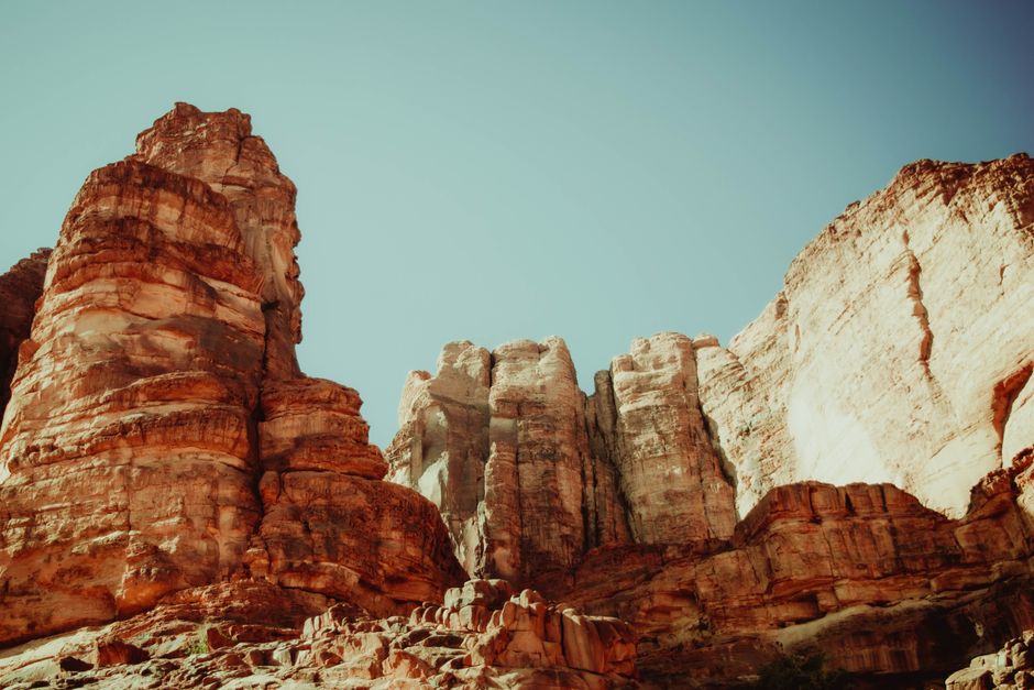 Stunning view of sandstone cliffs under a blue sky in Aqaba, Jordan.